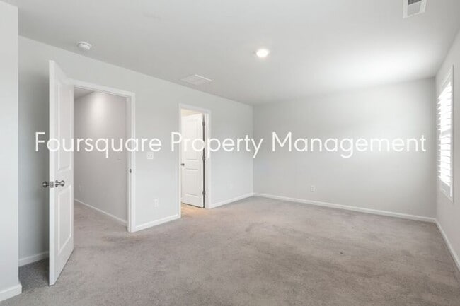 Building Photo - Stylish 3-Level Townhome with Bonus Suite, Deck & Garage – Near I-540 and Shopping