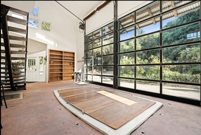 Community space: Atrium room with garage doors that open to the outside - 608 Sparkes Rd