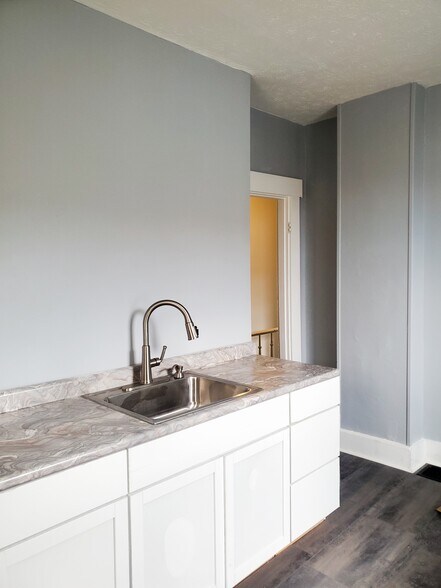 New cabinets kitchen sink, & floor - 131 S 7th St