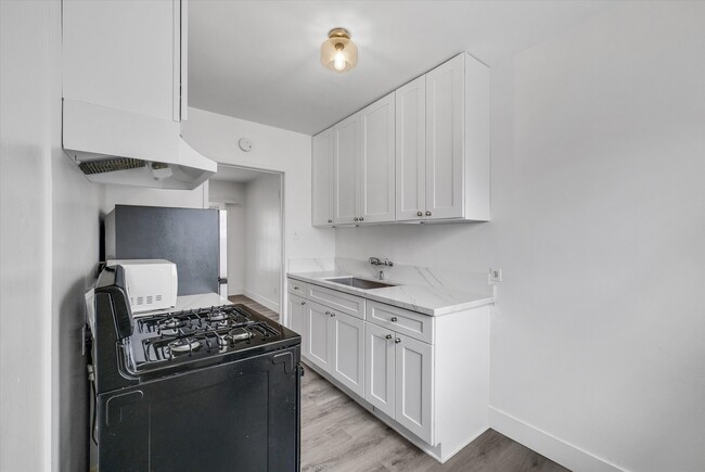 Kitchen S view and eatery area - 122 Elm Ave