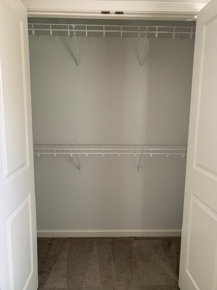 Upstairs Bedroom 2 closet - 6072 Herons Cir