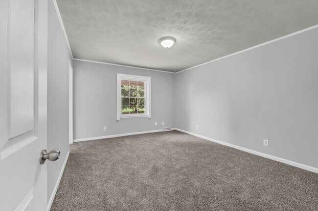 Building Photo - spacious 4-bedroom, 2.5-bath home featuring a 2-car garage and fresh updates throughout.