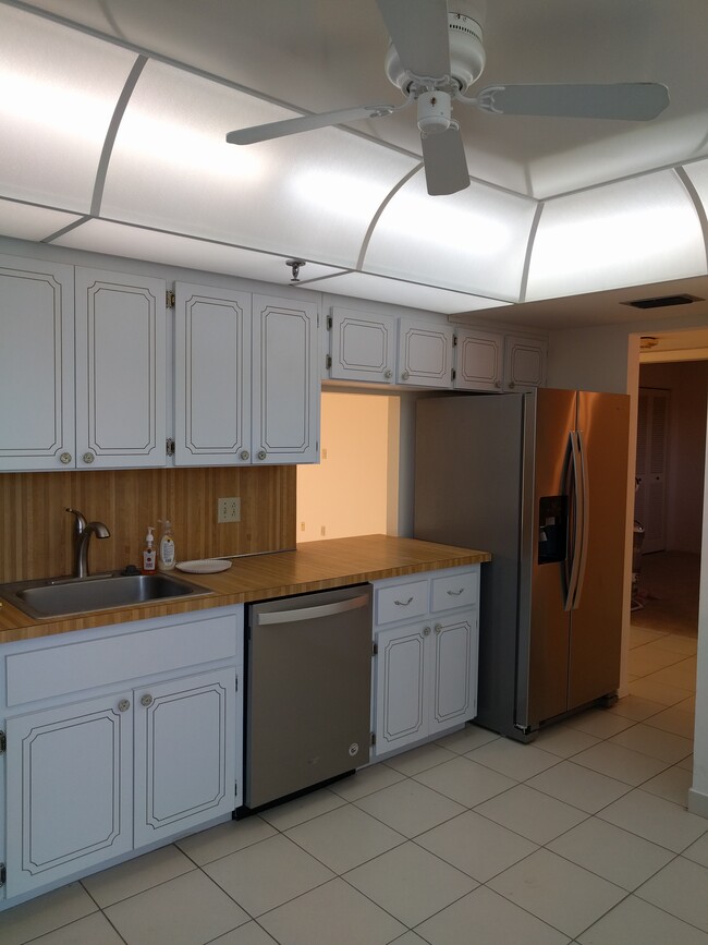 Large eat-in kitchen with window nook. New stainless steel appliances throughout. - 198 NW 67th St