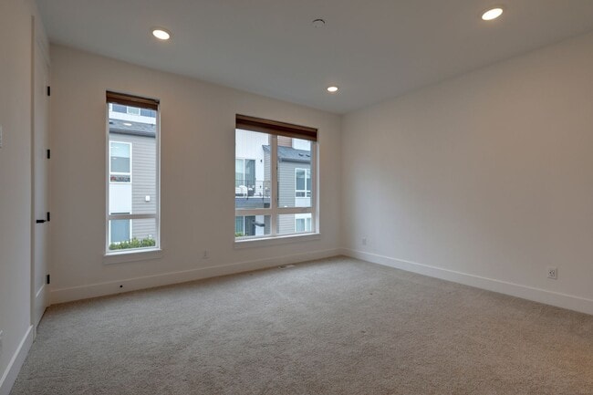 Building Photo - Live Where Style Meets Convenience – 2BR Townhome + Garage
