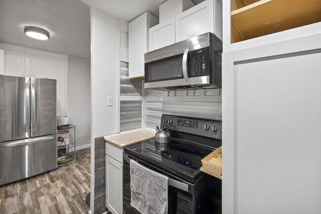 Building Photo - Live Above It All at the Satellite Condo!