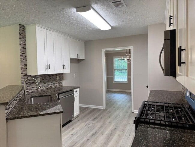 Building Photo - 7454 Woody Springs Dr
