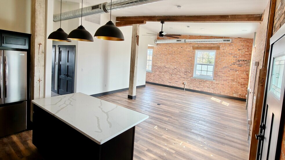 Open floor plan, new double pane windows throughout. Ceiling fans and spotlights in every room. - 101 W Broadway St
