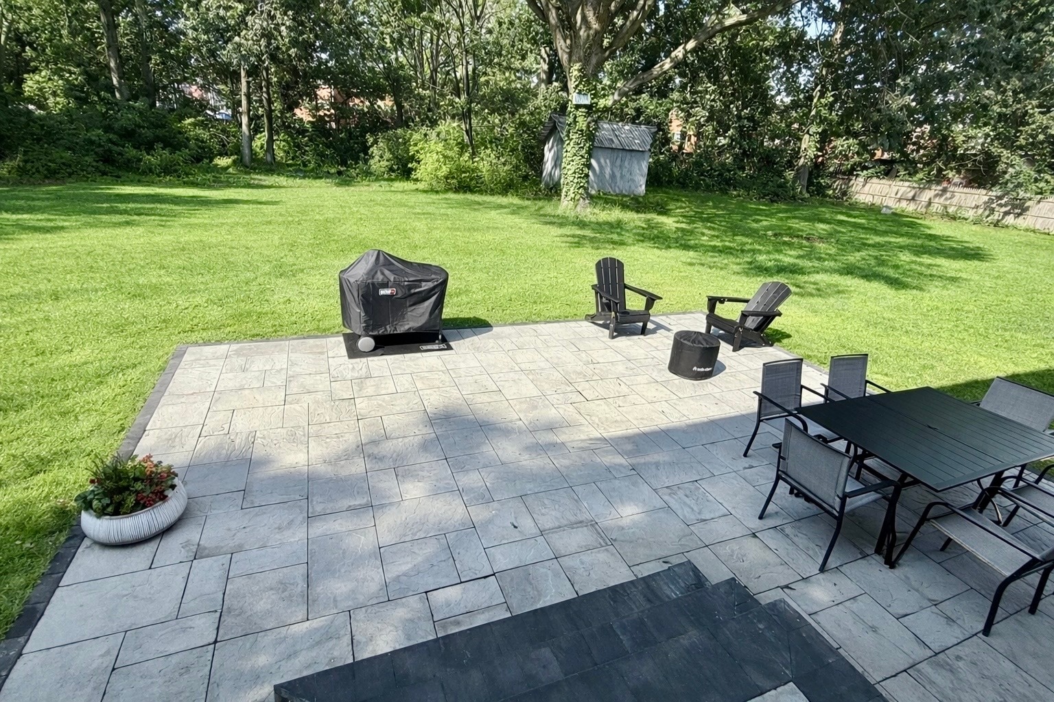 Spacious backyard featuring a large paved patio, perfect for outdoor dining - 2321 Farrand Dr