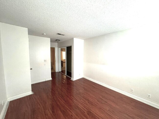 Building Photo - 2 Bedroom, 2 Bath Upstairs Condo with Private Balcony & 2-Car Garage, Gated Community, Water/Tras...