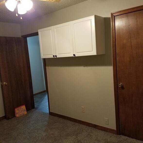 Bedroom with cabinet storage - 1222 Kimberly Dr