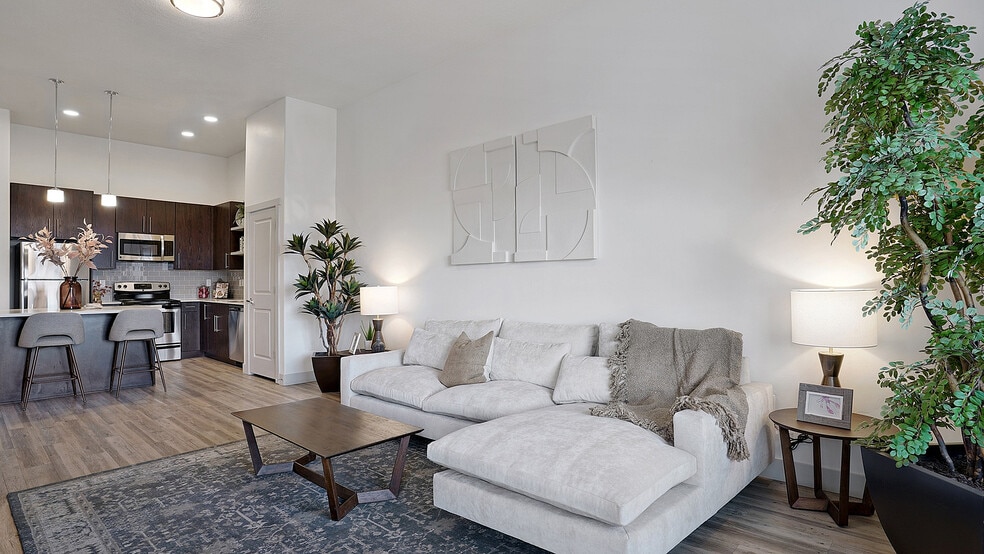 Open living and kitchen layout designed for everyday comfort. - Parkway Lofts