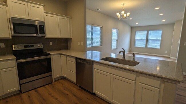 Building Photo - NEWER END UNIT TWO STORY TOWNHOME WITH A/C...