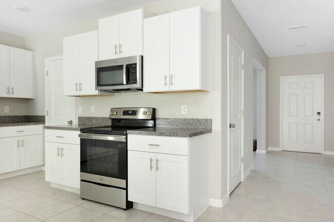 Building Photo - Spacious 5-Bed Touchstone Home – Primary Suite Downstairs, 2-Car Garage