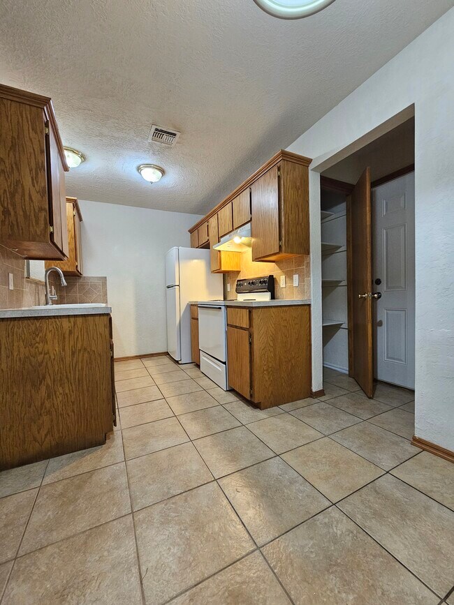 Kitchen (see storage cabinet) - 1905 SW E Ave