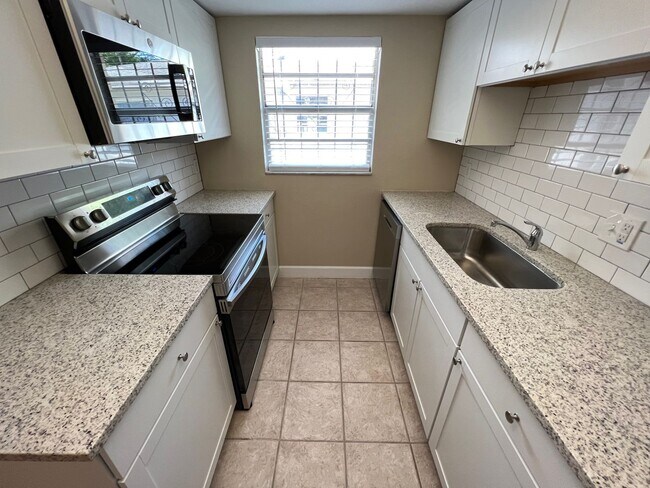 Building Photo - Newly Renovated 3/2 Home ~ Brand New Kitchen ~ Updated Bathrooms ~ Fenced Yard!