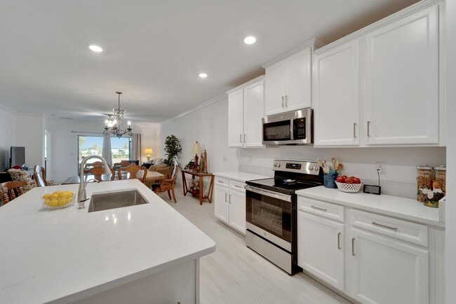 Building Photo - Luxury 55+ Villa with Lagoon Access in Med...