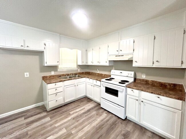 Building Photo - Spacious 4-Bedroom, 2-Bath Home Located in...