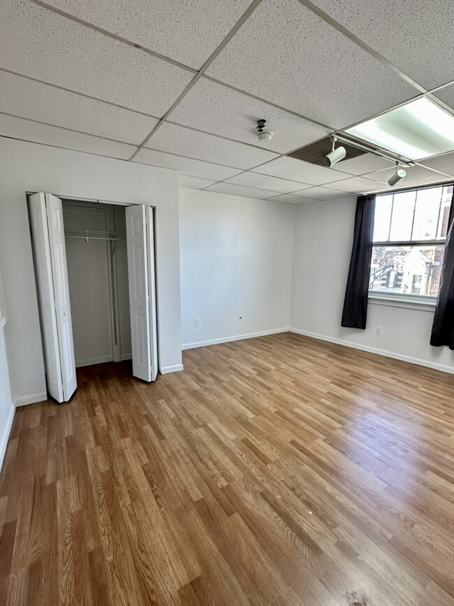 Bed room 2 with large closet and new double paned windows. - 5 E Broad St