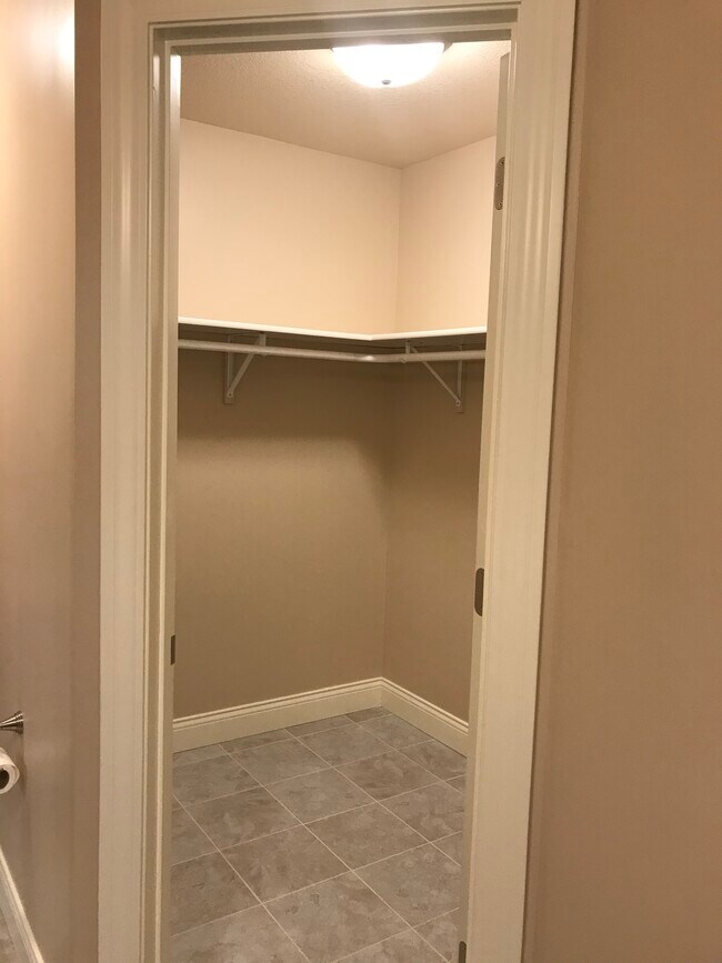 Master walk-in closet. - 113 Scenic Dr