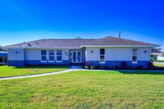 Building Photo - Waterfront Furnished Pool Home with Gulf & Canal Views in Estero Bay Shores