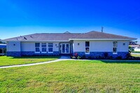 Building Photo - Waterfront Furnished Pool Home with Gulf & Canal Views in Estero Bay Shores