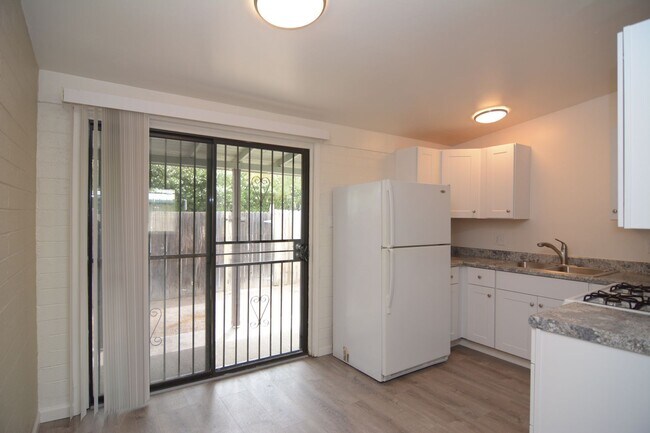 Building Photo - Remodeled 2 Bedroom 1 Bath Triplex! Close ...