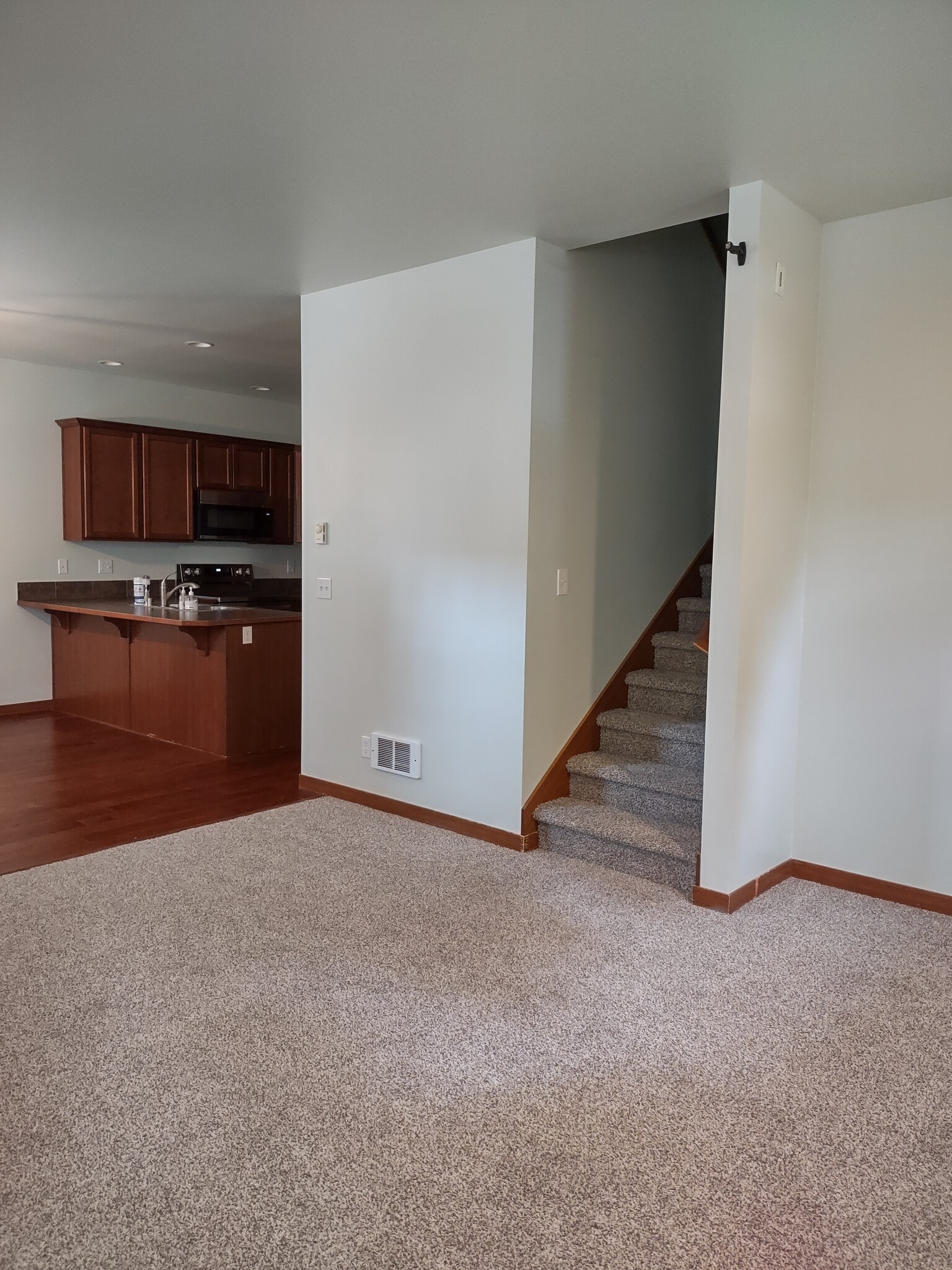 Stairway to the 2 bedrooms upstairs - 25818 Arklow Pl NE
