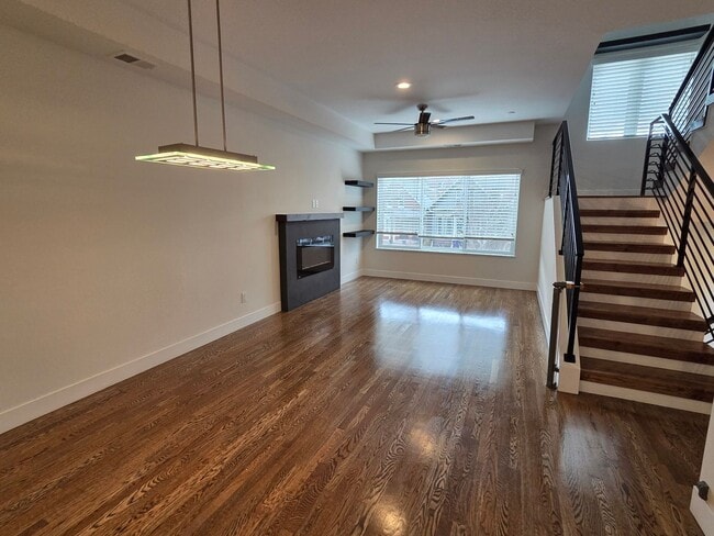 Building Photo - STUNNING 4-LEVEL TOWNHOME IN HIGHLANDS WITH SAUNA, 2-CAR GARAGE + AMAZING ROOFTOP DECK!