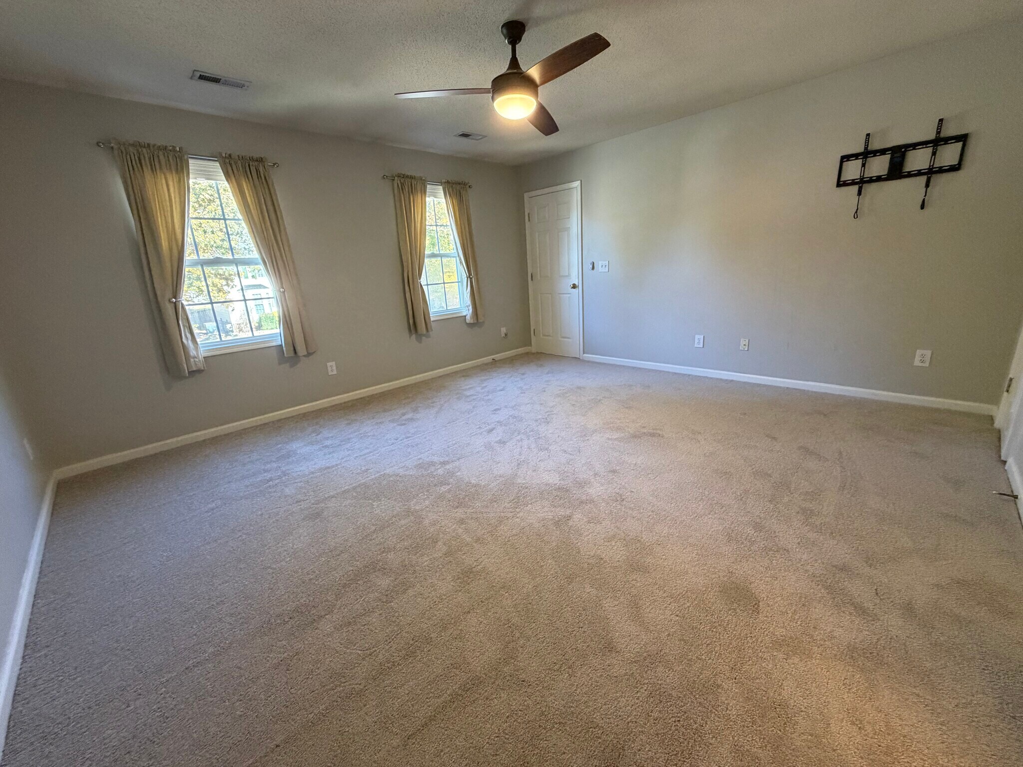 The Primary Bedroom has great light from the windows that overlook the front yard - 6419 Woodmont Rd