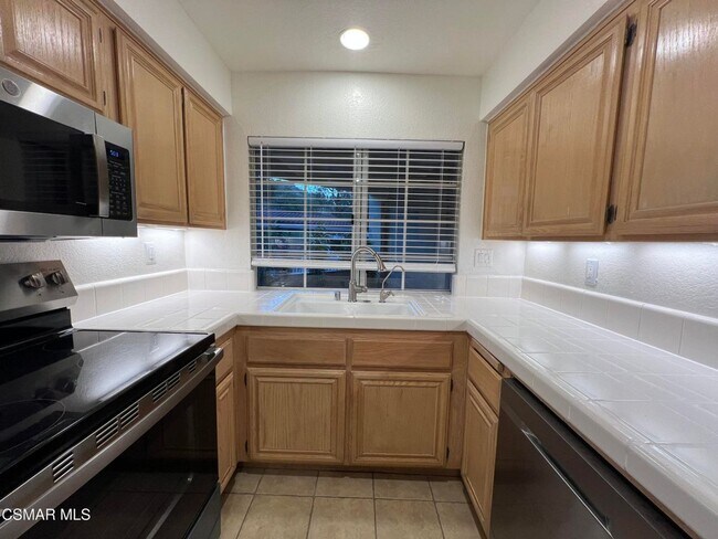 Building Photo - Welcome to this beautifully situated first-floor end unit