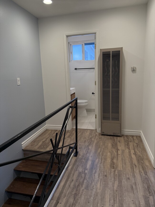 stairs leading to two bedrooms and full bath - 664 4th St