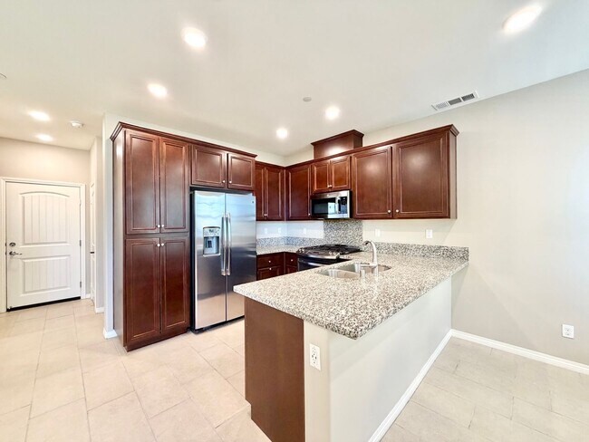 Building Photo - Move-In Ready 2 Bedroom 2.5 Bathroom Condo with LOFT & 2 Car Garage