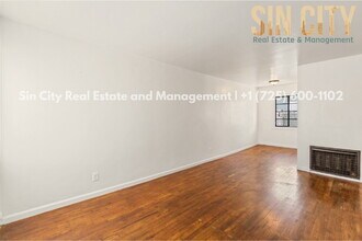 Building Photo - "Charming 1-Bed Duplex with Hardwood Elegance in Downtown Las Vegas!"