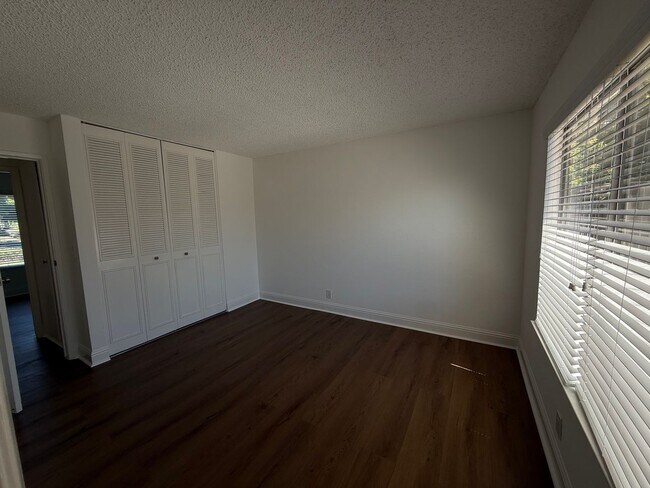 Building Photo - Recently updated home with new floors, paint & bathroom!