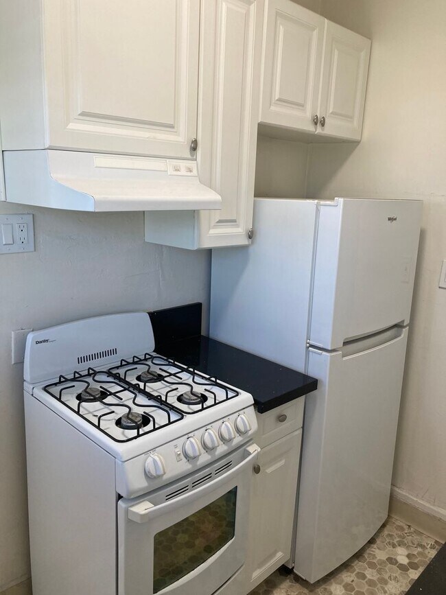 Building Photo - Spanish Garden Style Apartment Community