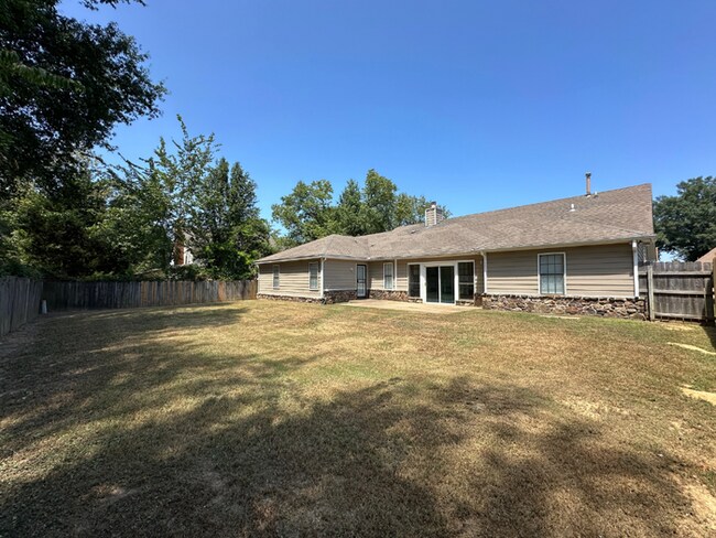 Building Photo - Grand 4BR/2BA Near Southwind | 2,438 Sq Ft, Stone Fireplace, Soaking Tub & 2-Car Garage