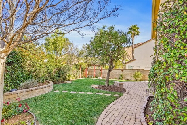 Building Photo - "Spacious 4-Bedroom Retreat with Cozy Fire...