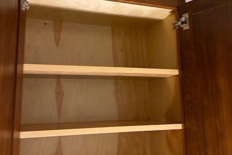 Cabinet over toilet - 641 Petro Point Dr