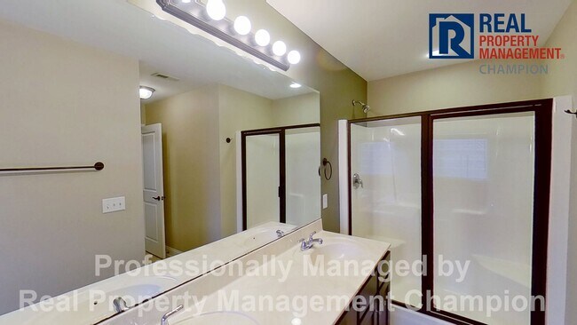 Building Photo - Beautiful home boasts open floorplan, screened porch, and spacious fenced yard