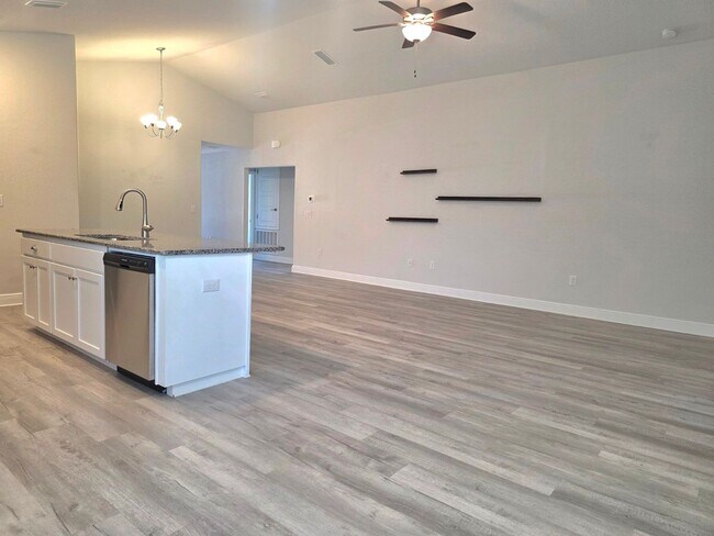 Building Photo - Bright, Open Layout | Screened Porch + Paver Patio | Move-In Ready