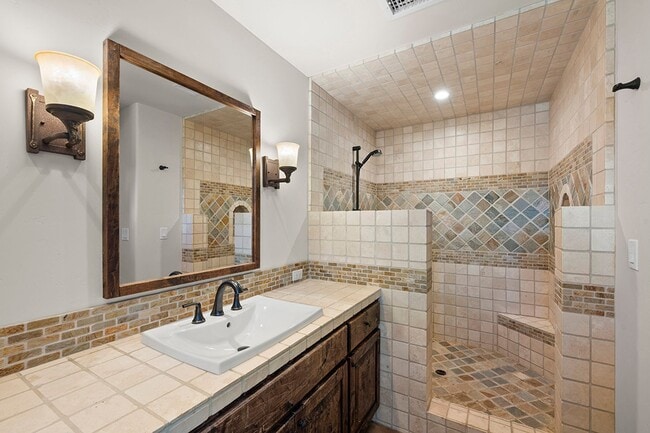 Building Photo - This Beautiful Hacienda Style Home combine...