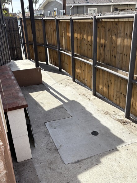 Private concrete patio with privacy fence - 4410 36th St