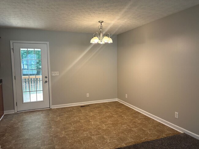 Building Photo - Charming Home with Covered Back Deck and Fenced in Yard...