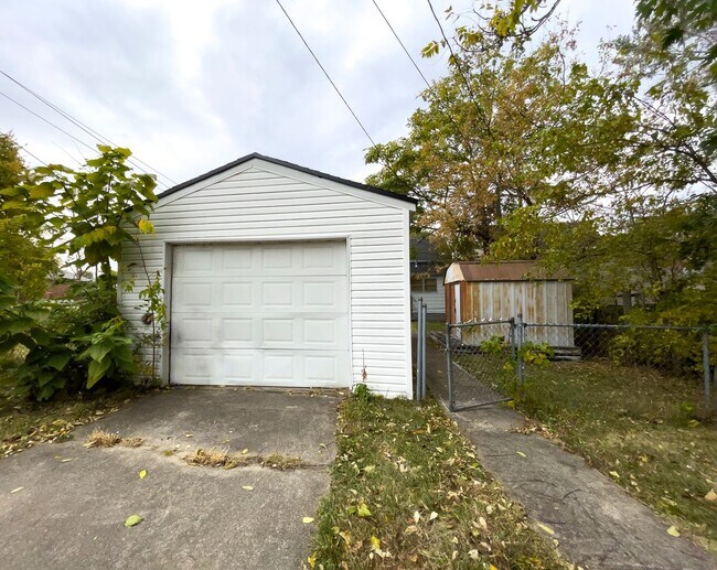 Building Photo - Fall into this cozy 3-Bedroom Home with a fenced in yard & detached garage!