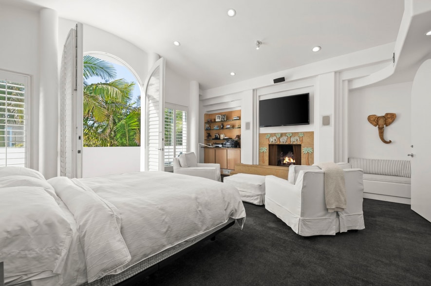 Gas fireplace anchors a sun-drenched primary suite occupying the entire third floor. - 120 Mast Mall