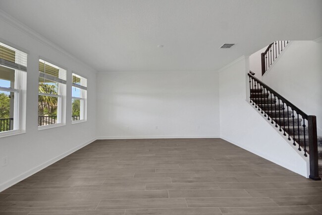 Building Photo - Stunning 4/3 in Gated Dora Parc! Water Views!
