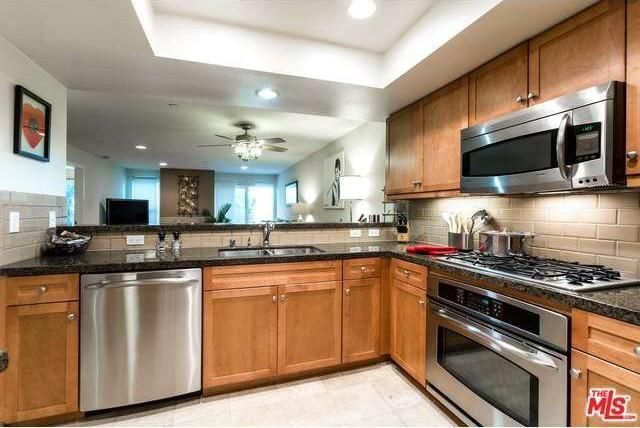 Kitchen overlooking living room/dining area room - 1951 N Beachwood Dr