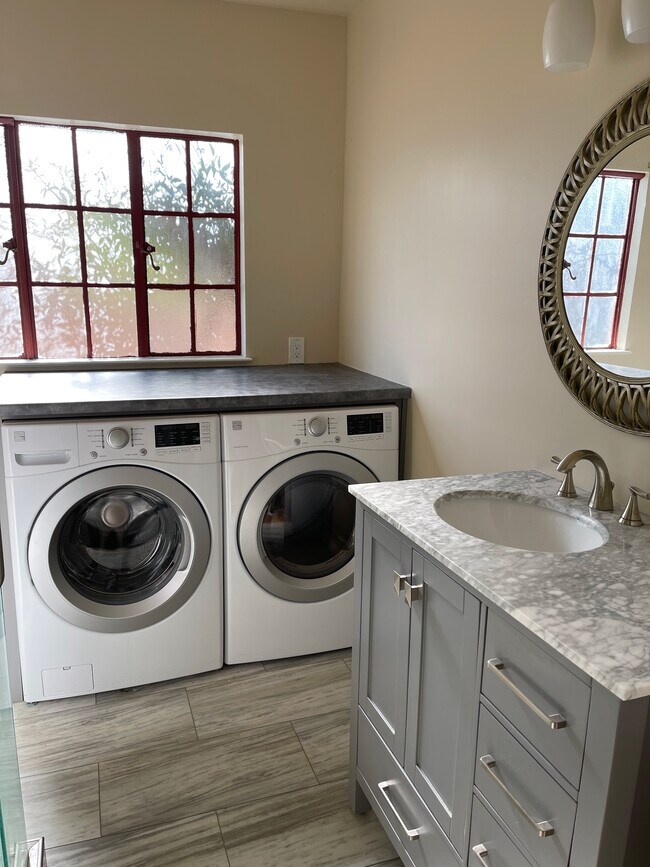 Washer and dryer in updated bathroom - 517 Benton St