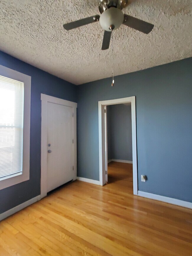 living room with ceiling fan - 3418 W Armitage Ave