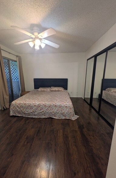 Spacious master bedroom with generous closet space and access to a connecting balcony - 5652 Yolanda Ave